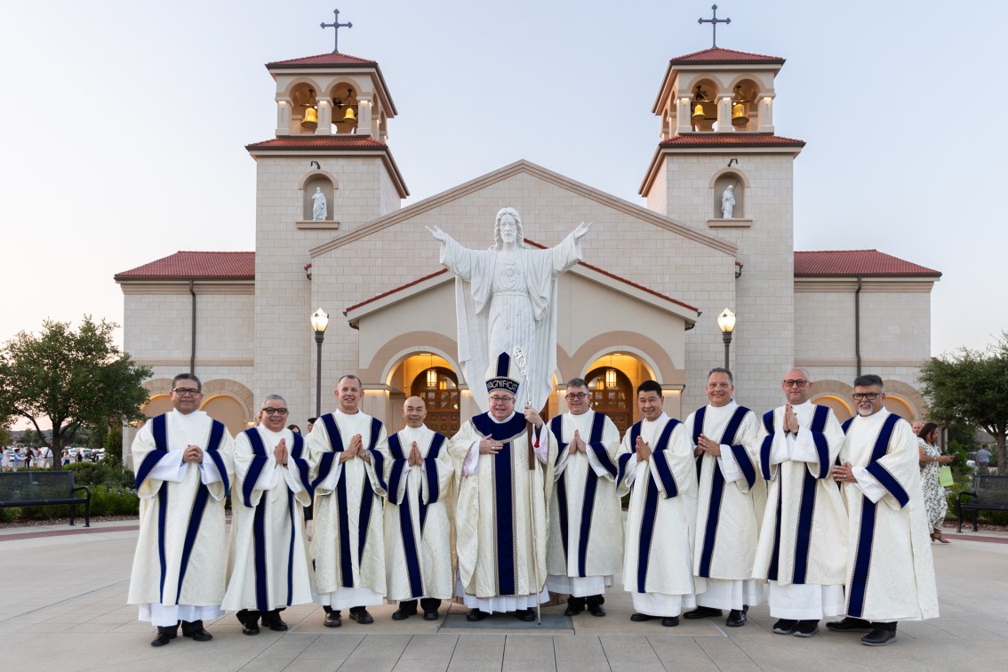 deacons and Bishop Olson in front of St. Mark Church