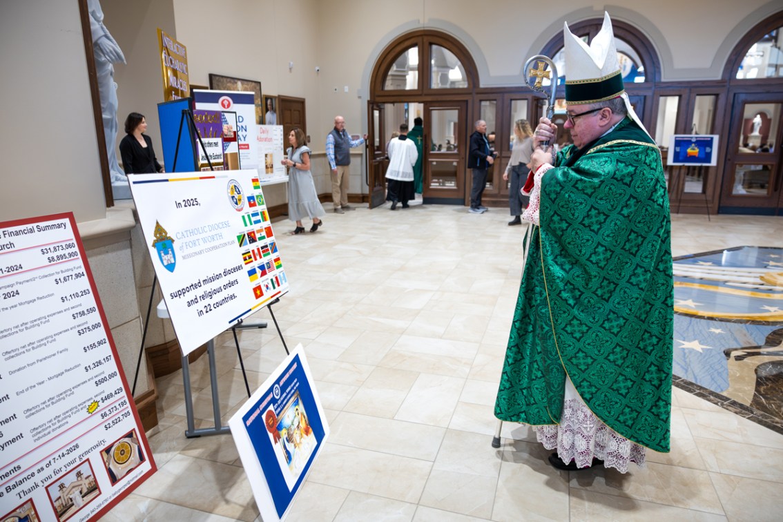 Bishop Olson looks at display